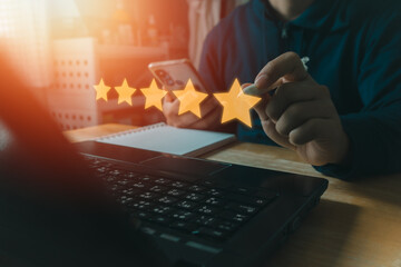 Customer review good rating concept people use a laptop computer and press five star rating for...