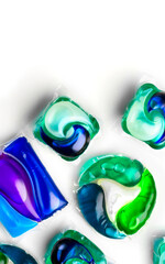 Washing capsules, colorful laundry pods border design. Colorful Soluble capsules with laundry gel detergent and dishwasher soap. Pile of wash pod capsules isolated. Detergent tablets. Top View. 