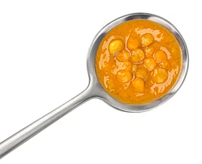 Gordijnen Lentil cream soup in spoon isolated on white background, top view © xamtiw