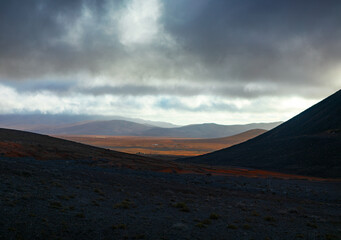 Landscape in the highlands of Iceland. Dramatic sky over the hills