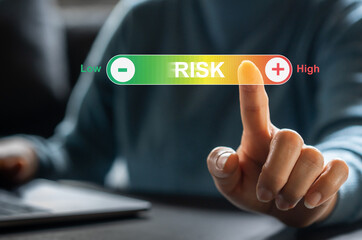 Human hand touching on risk management and assessment for business investment concept. business, technology, internet and network concept, forecasting evaluation financial business concept.