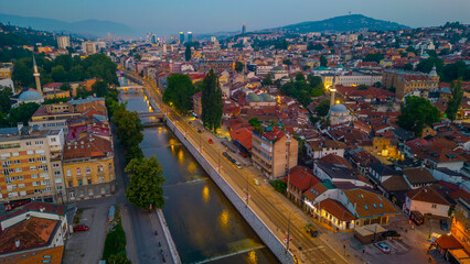 Naklejka premium Sunrise over Mlijacka river in the center of Sarajevo, Bosnia and Herzegovina