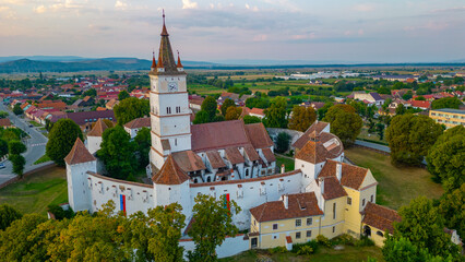Sunset view of the Fortified Evangelical Church in Harman, Romania