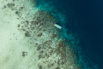 Aerial view of snorkeling activities among a coral reef