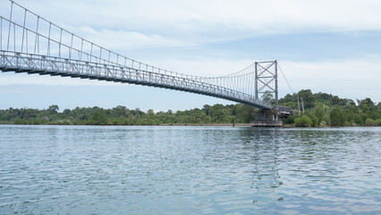 A suspension bridge that connects two small islands