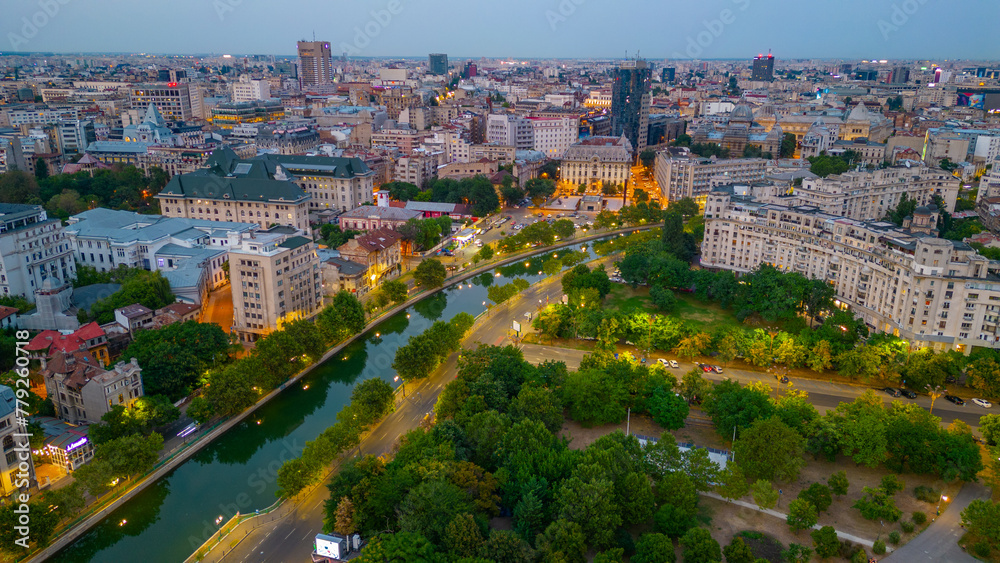 Poster sunset panorama view of dambovita river passing the old town of bucharest, romania