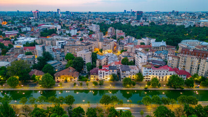 Sunset panorama view of Dambovita river passing the old town of Bucharest, Romania