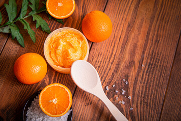 Orange scrub for face or body. Cosmetic product made of natural ingredients. Studio photo.