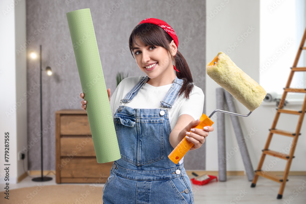 Wall mural Woman with wallpaper roll and roller in room