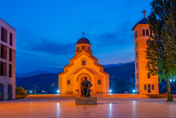 Illuminated church of Saint Tzar Lazarus in Andricgrad, Visegrad, Bosnia and Herzegovina - obrazy, fototapety, plakaty