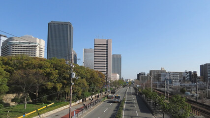 Fototapeta na wymiar Japanese view of skyscrapers along Tamatsukuri-suji from Osakajokoen Station