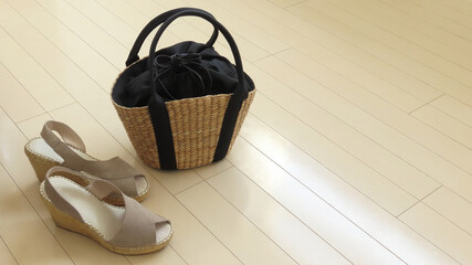 Women's summer fashion coordination with sandals and a basket bag