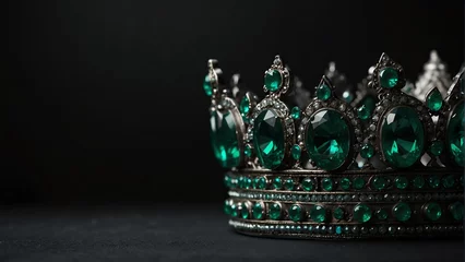 Poster a royal crown with green emerald shiny sparkling gemstones on plain black background from Generative AI © Arceli