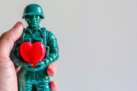 A soldier holding a heart in his hand