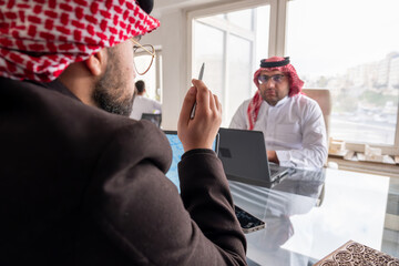 meeting between two arabs talking about work details