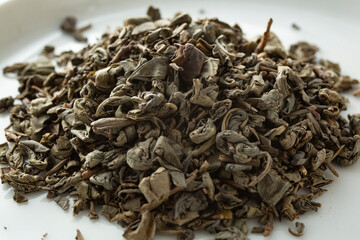 A closeup view of a pile of gunpowder loose leaf tea.