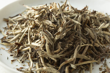 A closeup view of silver needles white tea loose leaf tea.