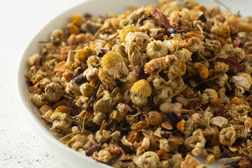 A closeup view of a pile of bianca chamomile blend herbal tea ingredients.