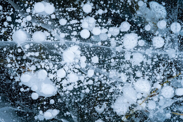 Beautiful ice of Lake Baikal with abstract cracks