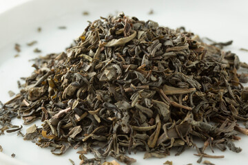 A closeup view of a pile of loose leaf chunmee green tea.
organic chunmee, green tea, china