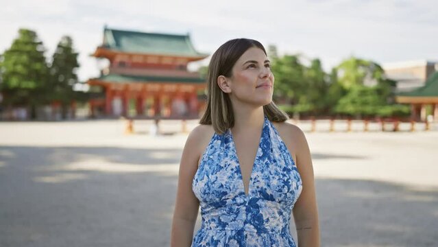 Beautiful hispanic woman, a radiant portrait of happiness and confidence, smiling and posing joyfully at traditional heian jingu in kyoto, japan, portraying carefree fun and success