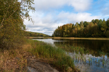 Obraz premium View from the shore of Lake Ladoga near the village of Lumivaara on a sunny autumn day, Ladoga skerries, Lahdenpohya, Republic of Karelia, Russia