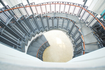 Upside view of a spiral staircase. Spiral staircase modern architecture detail.