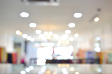 Abstract blur and defocused clothing department store in shopping mall interior for background.