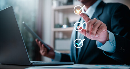 checklist, checkmark, chart, intelligence, management, marketing, solution, strategy, analysis, information. A man is pointing at three check marks. Concept of accomplishment or satisfaction.