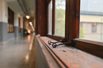 Fototapeta premium TW - 01.24.24: The wooden framed windows inside Songshan Cultural and Creative Park (formerly Songshan Tobacco Factory), built in 1937, bear witness to Taiwan's industrial and architectural history.