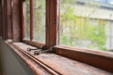 TW - 01.24.24: The wooden framed windows inside Songshan Cultural and Creative Park (formerly Songshan Tobacco Factory), built in 1937, bear witness to Taiwan's industrial and architectural history.