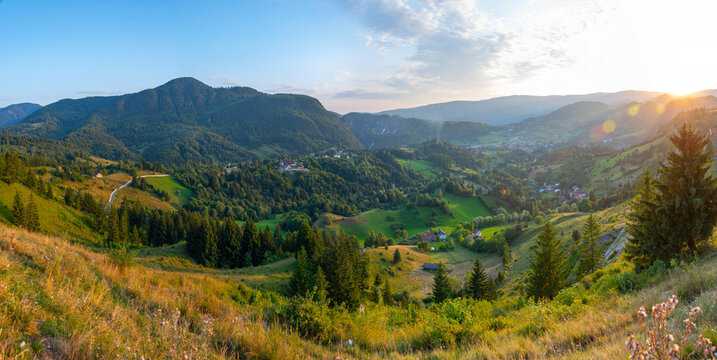 Sunset view of a village in a valley in Transylvania, Romania