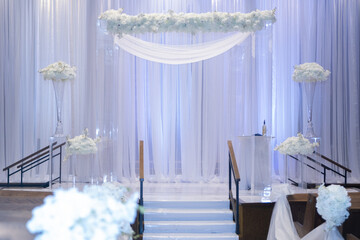 Beautiful photo of the Jewish Hupa , wedding putdoor .Beautifully registered Huppa with a petals of roses are laid out a heart