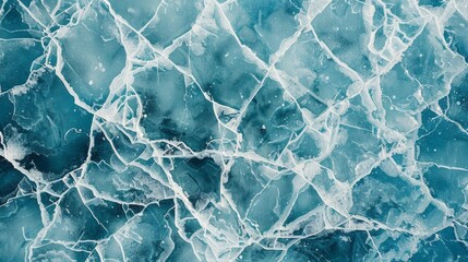 A top-down view of an icy lake shows cracked ice, intricate patterns, and textures in shades of blue and white.