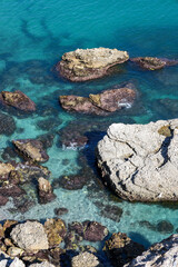 View of beautiful blue water and rocks in Nerja Spain