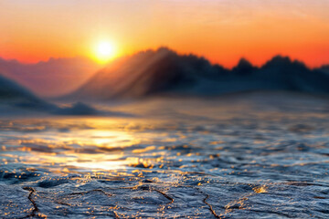 Sunset over a frozen landscape with stone surface textures in the foreground. Winter beauty and...