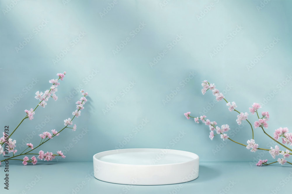 Poster white podium with cherry blossoms on a blue background. minimalist display for product presentation.