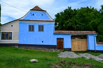 Fototapeta na wymiar Traditional, typical farm, farmhouse in the village of Viscri or Deutsch-Weisskirch near Rupea, Brasov, Transylvania, Romania 