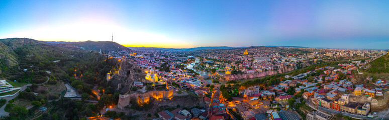 Sunset view of Narikala fortress overlooking downtown Tbilisi in Georgia © dudlajzov