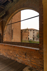 Obraz premium City of Ferrara, historic center, fortifications and castle surrounded by a moat. Squares and buildings in medieval style. Beautiful, unique Italian cities. World cultural heritage. Precious details. 