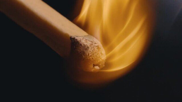 Macro Close up of a match burning in super slow motion, 4k 800fps fire flame match disintegrating