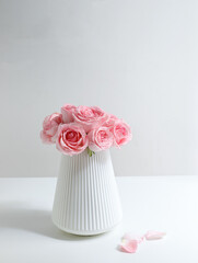 Pink roses for Valentine's Day on a white table top