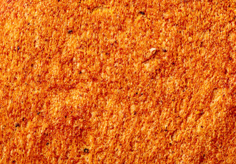 Ruddy crust of bread as an abstract background. Texture