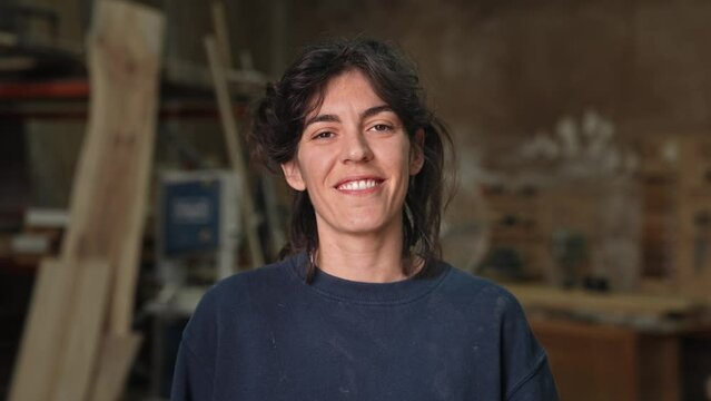 Woman carpenter portrait. Feminist girl process wood. Male carpentry work skill. Female joiner woodwork. Feminism worker smile. Person woodworker look at camera. Diy master class workshop. Job project
