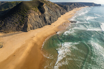 Aerial droe view of beautiful natural Cordoama beach in Portugal Atlantic coast - 779407994