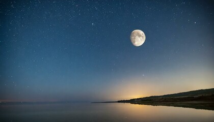 Naklejka na ściany i meble a beautiful night landscape with a clear sky full of stars, a beautiful moon and the ocean beneath it