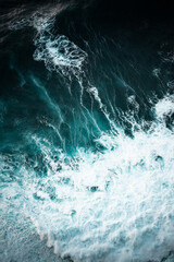 Ocean waves crashing, top down aerial drone view. Storm on sea or ocean