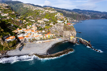 Ponta do Sol in Madeira Island, Portugal. Aerial drone view at cityscape of coastal town and beach - 779409561