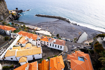Ponta do Sol in Madeira Island, Portugal. Aerial drone view at cityscape of coastal town and beach - 779409569