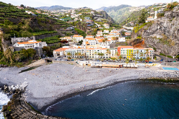 Ponta do Sol in Madeira Island, Portugal. Aerial drone view at cityscape of coastal town and beach - 779409721